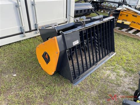 wolverine concrete mixer skid steer|skid steer tiller wolverine attachment.